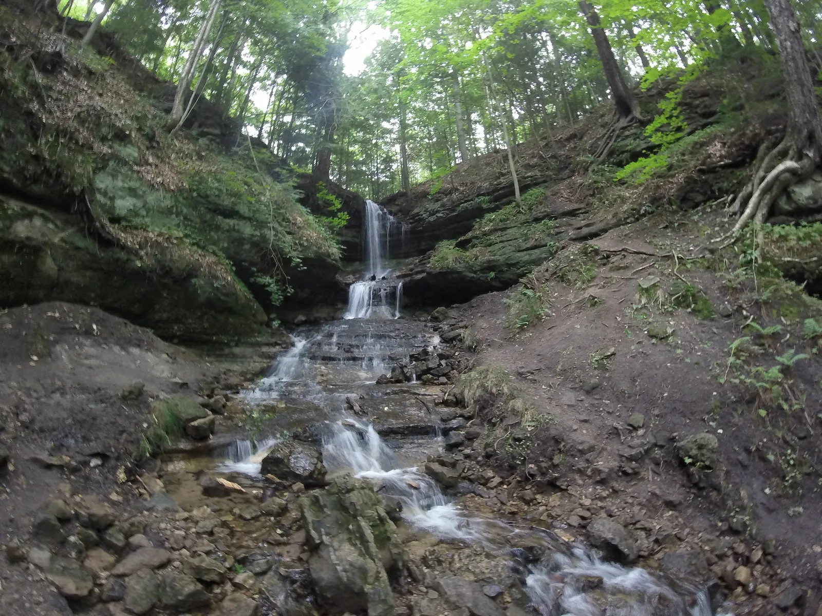 Horseshoe Falls — a narrow tall drop in a deeply-eroded sandstone amphitheater near Munising.