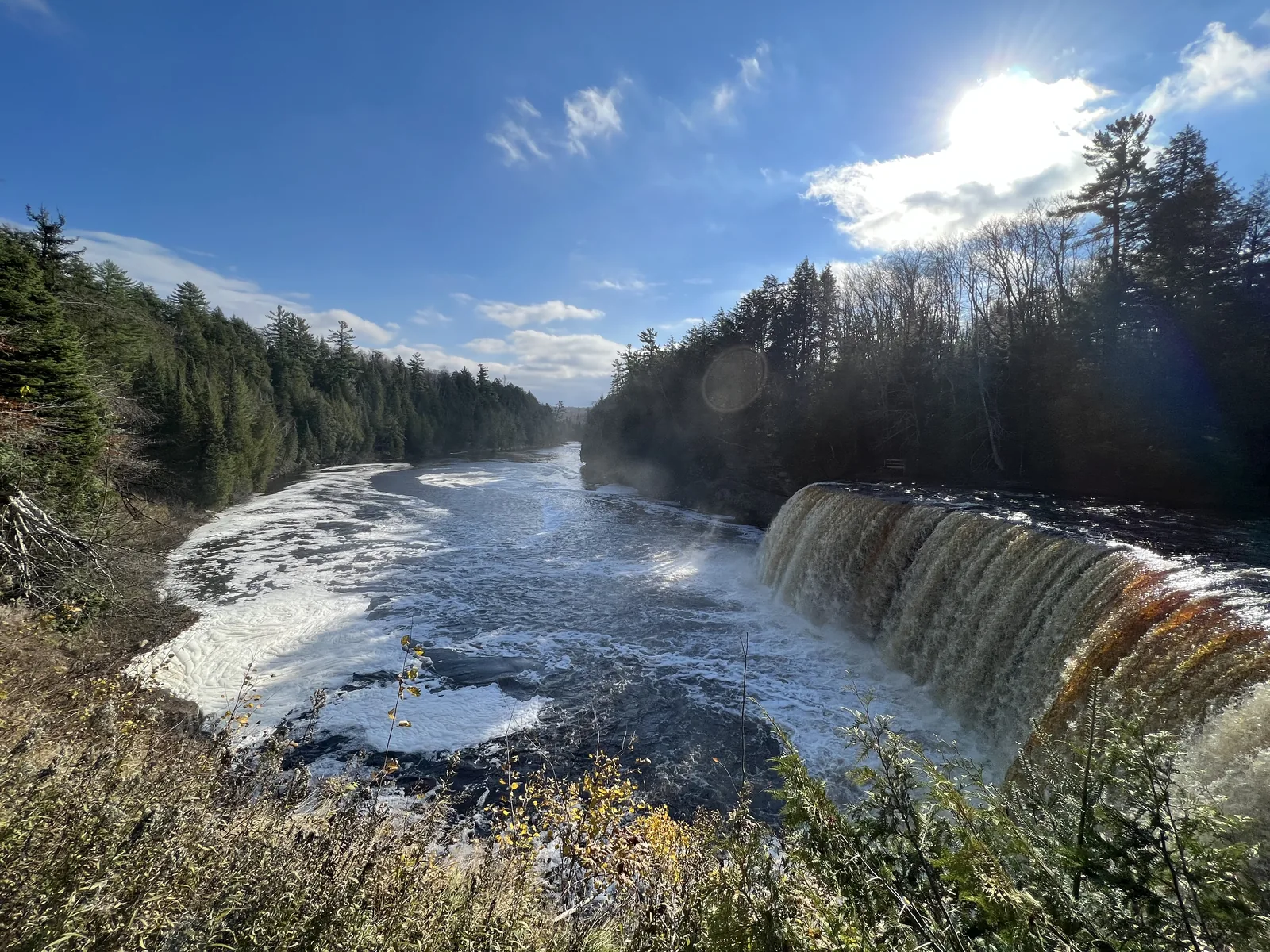 Upper Tahquamenon Falls — the iconic 200-foot-wide curtain of root-beer colored water on the Tahquamenon River.